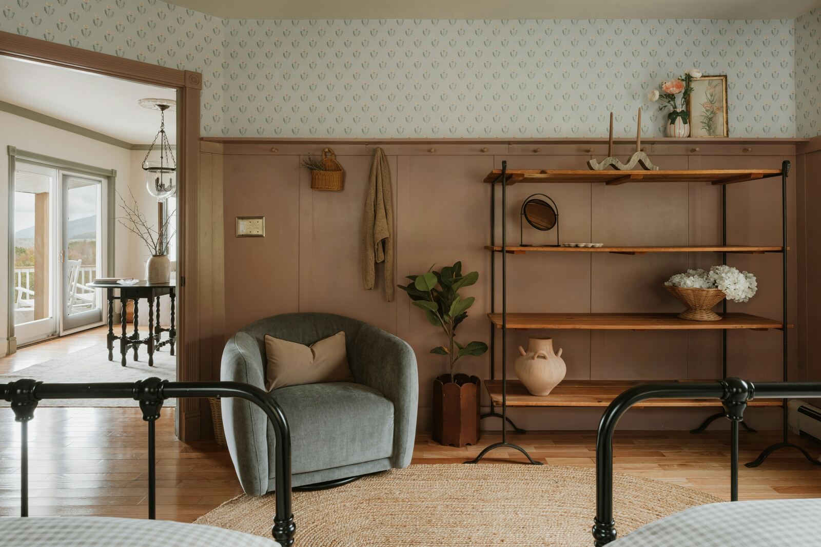 Cozy neutral bedroom with armchair and shelving